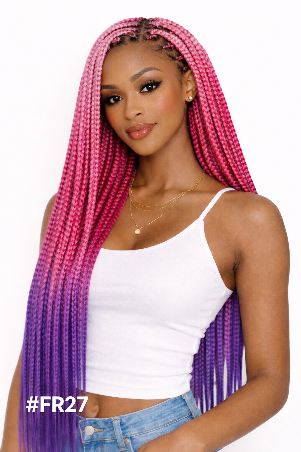Woman with pink to purple ombre braided hair wearing a white top and blue jeans on a white background. in Qatar